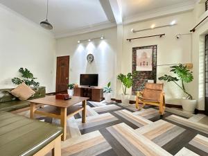TV a/nebo společenská místnost v ubytování BÊ TÔNG RESIDENCES HOMESTAY