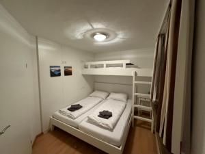 GO FOR MOUNTAINS Appartements房間的床