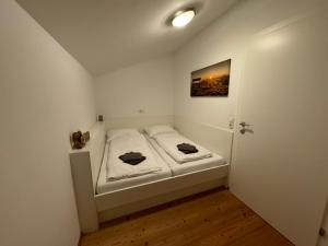 GO FOR MOUNTAINS Appartements房間的床