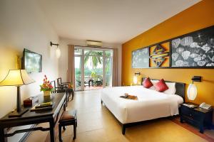 Voodi või voodid majutusasutuse Hoi An Beach Resort toas