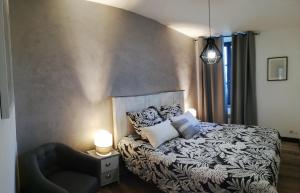 Łóżko lub łóżka w pokoju w obiekcie Appartement sous les remparts