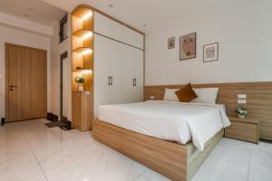 Giường trong phòng chung tại Dodo home AC