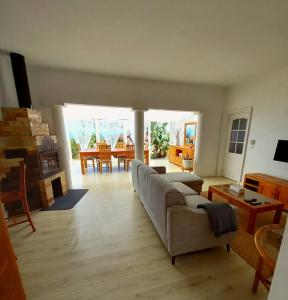 a living room with a couch and a table at Casa Betania ocean view in La Orotava