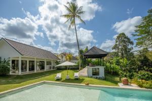 an image of a villa with a swimming pool at Bos Villas Bali in Ubud