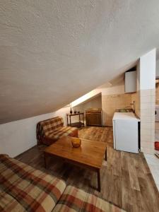 a living room with a couch and a table at Dobrota Comfort in Kotor