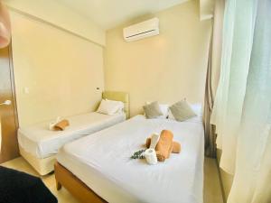 Katil atau katil-katil dalam bilik di Cozy 2br with pool and beach access