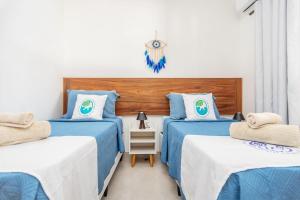 Postel nebo postele na pokoji v ubytování Arpoador Apts Praia & Piscina - Buzios Rentals