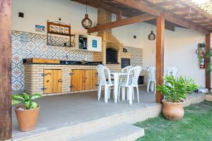 Kuchyň nebo kuchyňský kout v ubytování Arpoador Apts Praia & Piscina - Buzios Rentals