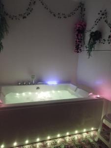 a bath tub with lights in a room at Casa Rural Majaceite in El Bosque