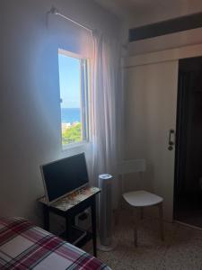 TV a/nebo společenská místnost v ubytování 1 person Studio - Casa Teresita