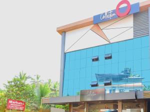 a building with a sign on the side of it at Super Collection O Marhaba Govindapuram in Calicut