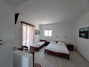Postel nebo postele na pokoji v ubytování Areti & Maria Apartments