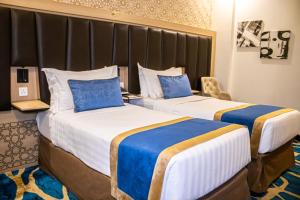 Ένα ή περισσότερα κρεβάτια σε δωμάτιο στο Taba Al Salam +52 φωτογραφίες