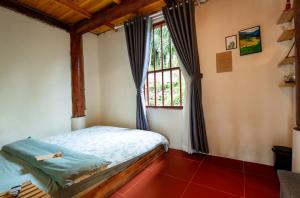 Postel nebo postele na pokoji v ubytování Moc Home Sapa
