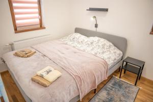 A bed or beds in a room at Divčinova S4