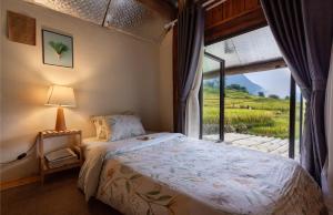 Postel nebo postele na pokoji v ubytování Moc Home Sapa