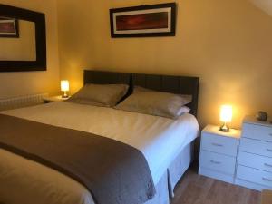 En eller flere senge i et værelse på Promenade Cottage, Newcastle, County Down