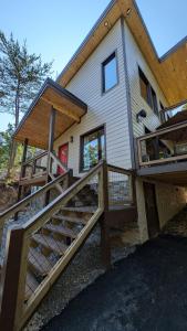 a house with a staircase leading up to it at Beautiful! Moonlight view Luxury cabin in Townsend