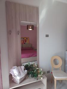 Postel nebo postele na pokoji v ubytování Casa Vacanze Borgo Garibaldi