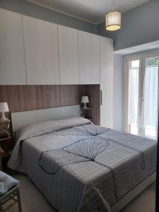 Postel nebo postele na pokoji v ubytování Casa Vacanze Borgo Garibaldi