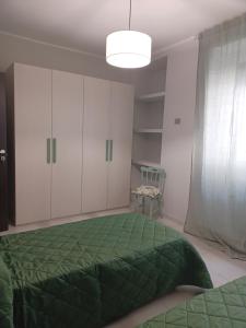 Postel nebo postele na pokoji v ubytování Casa Vacanze Borgo Garibaldi