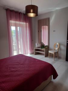 Postel nebo postele na pokoji v ubytování Casa Vacanze Borgo Garibaldi