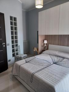 Postel nebo postele na pokoji v ubytování Casa Vacanze Borgo Garibaldi