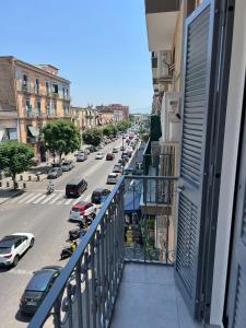 a view of a city street from a balcony at Familia in Naples