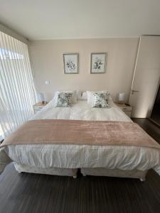 Ένα ή περισσότερα κρεβάτια σε δωμάτιο στο Kennedy Premium Apartments Colorado