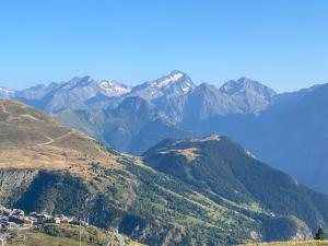 a view of a mountain range with mountains in the background at Alpe d'Huez 21 in LʼHuez