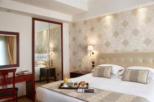 Voodi või voodid majutusasutuse Ava Hotel and Suites toas
