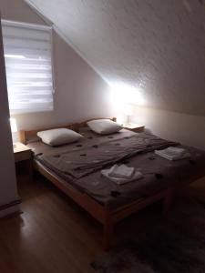 Postel nebo postele na pokoji v ubytování VILA NATALIJA APARTMANI