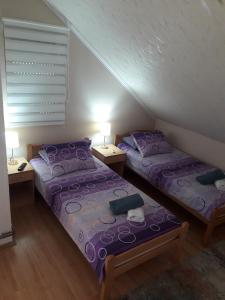 Postel nebo postele na pokoji v ubytování VILA NATALIJA APARTMANI