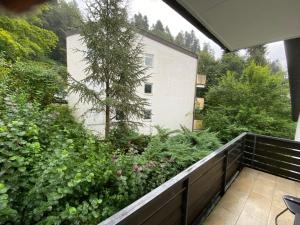 a garden on the balcony of a house at Park und Therme in Bad Wildbad