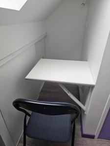 a white desk and a chair in a room at Purple Baroque Rer C -N104-A6 in Brétigny-sur-Orge +11 photos