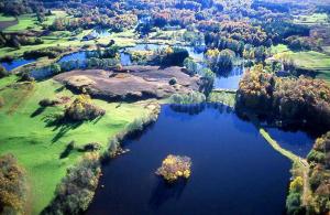 an aerial view of a lake with trees and water at ~ Parenthèse bucolique ~ in Saint-Germain