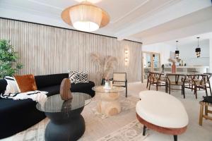 a living room with a couch and a table at Breathtaking house with patio in Roma Norte in Mexico City +112 photos