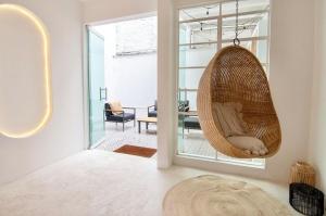 a hanging hammock in a room with a living room at Breathtaking house with patio in Roma Norte in Mexico City