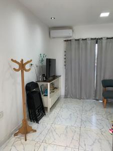 a room with a cross on the floor and a room with a cross at Angelina in Posadas