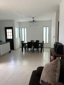 a living room with a table and chairs at In Wotoch in Cancún
