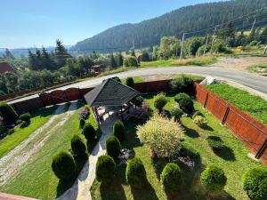 an overhead view of a garden with bushes and trees at Csermely Panzio in Izvoru Mureşului