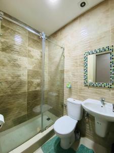a bathroom with a toilet and a sink and a shower at appartement 1 chambre Centre ville in Agadir