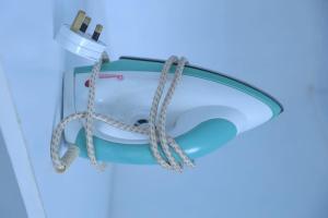 a light with a rope hooked up to it at MERU MODERN LIVING BNB 1 AND 2 BEDROOMS in Meru