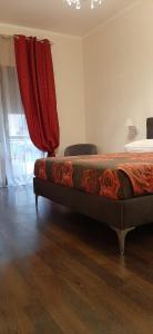 A bed or beds in a room at Appartamento ALECATIA 2