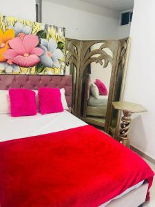 Una cama o camas en una habitación de Hostal Caribe 21