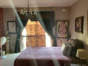 a bedroom with a bed and a window at sunrise flats in Mellieħa