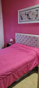 En eller flere senge i et værelse på Departamento RyJ