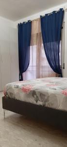 A bed or beds in a room at Appartamento ALECATIA 2