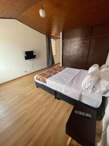 Cama o camas de una habitación en Bamuka Hostal