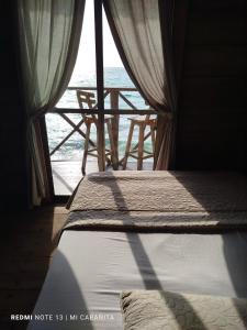 Postel nebo postele na pokoji v ubytování Mi Cabañita Guest House